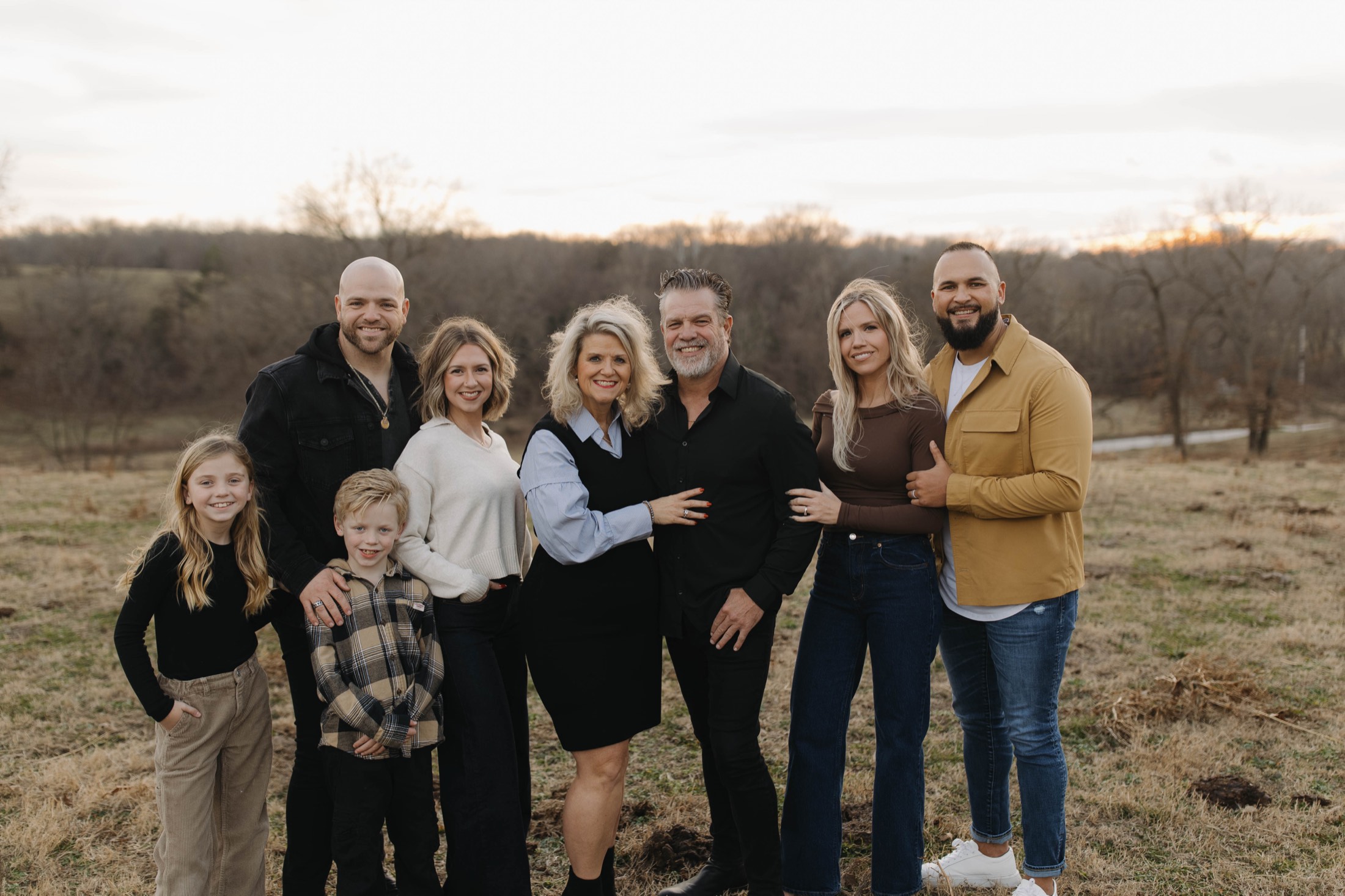The whole Bilderback family together in a golden winter field.