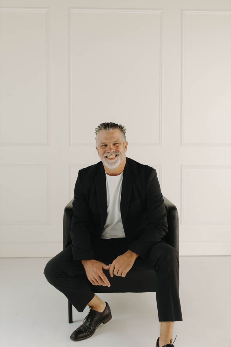 A portrait of Euel Bilderback, smiling.