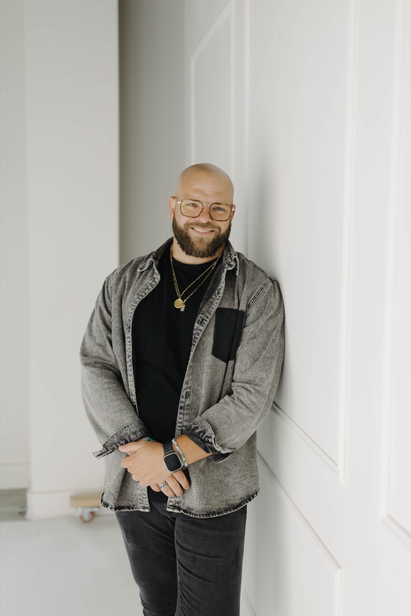A portrait of Blake Bilderback, smiling.